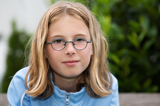 Portrait of a young girl wearing glasses