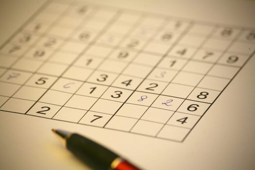 Sudoku with black and red ballpoint pen