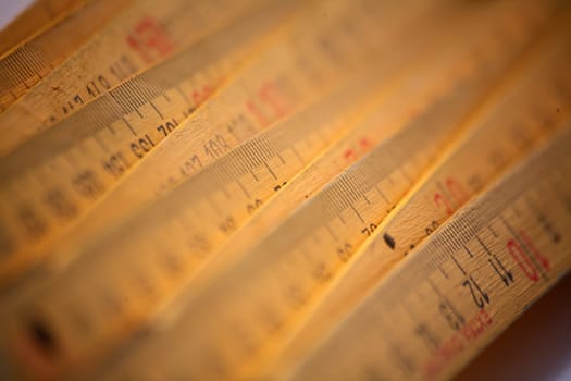 Yellow wooden measuring rod made in Germany
