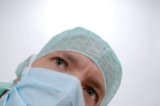 Doctor in the operating room looking up