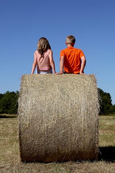 Two on the hay bale
