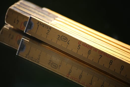 Yellow wooden measuring rod made in Germany