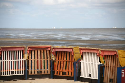 Lonely beach chairs on the North Sea coast