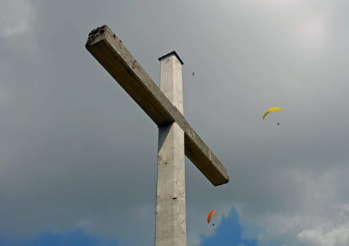 Often the cross and the sport of hang gliding are only one step away from each other