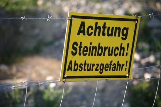 Sign on the edge of a quarry