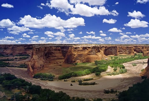 Canyon de Chelly National Monument is located in northeastern Arizona and is part of the Navajo Nation Reservation. Two roads run over the canyons along the rims,North Rim Drive at Canyon del Muerto and South Rim Drive at Cany