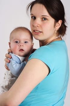Mom holds her child in her arms