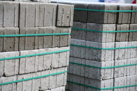 Bundled paving stones at a construction site