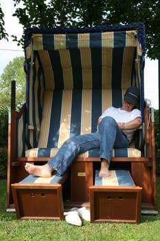 Relax in a beach chair in the garden
