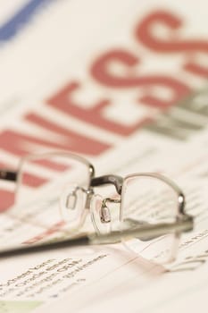 Newspaper with glasses