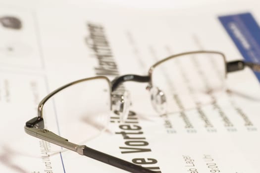 Newspaper with glasses