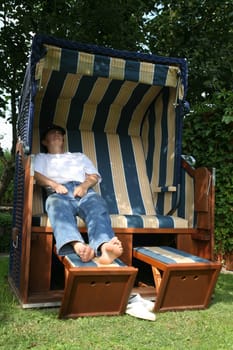 Relax in a beach chair in the garden