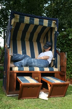 Relax in a beach chair in the garden