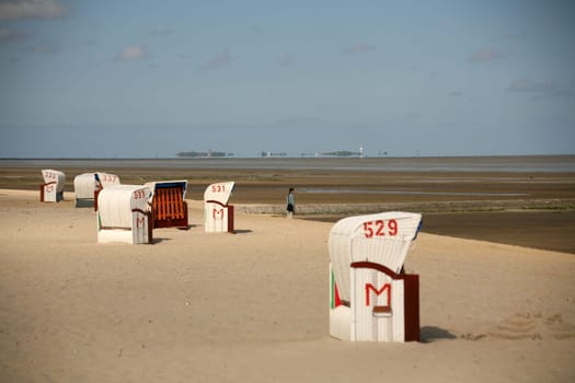 On the beach of Cuxhaven-Döse - in the background on the horizon the Hallig Neuwerk