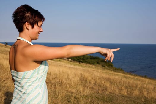 A young girl points her finger at the future