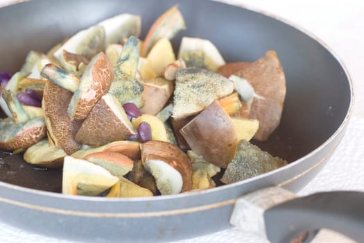 fresh edible mushrooms in a pan