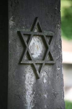 Star of David on the tombstone of an old Jewish cemetery