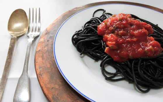 Black pasta with red sauce