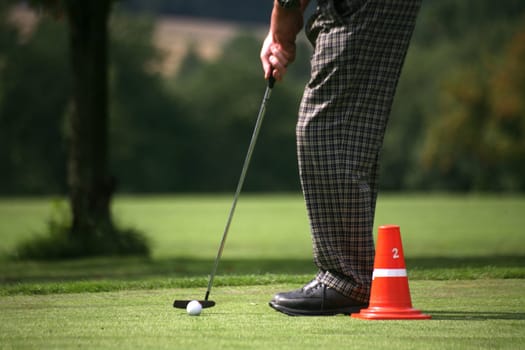 Golfers practicing