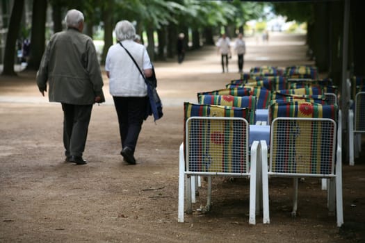 Strollers and deserted tables of a street café