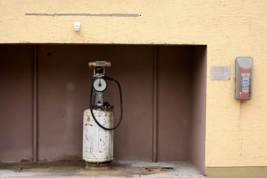Rusty fuel pump with fire extinguisher