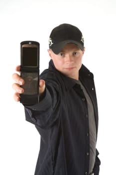 A young man in a baseball cap holds a mobile phone directly into the camera