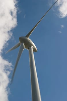 Wind turbine in front of a cloudy sky