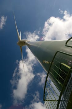 Wind turbine in front of a cloudy sky