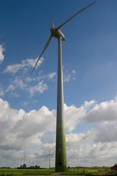 Wind turbine in front of a cloudy sky