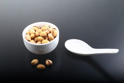 Salted pistachios in shell and loose