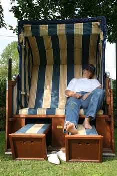 Relax in a beach chair in the garden