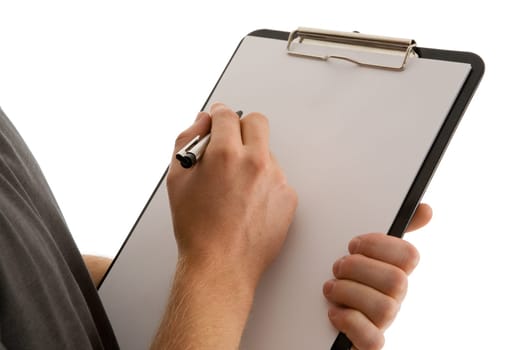 Detail shot of a paper clipboard held by one hand and the other holding a pen,freeing up space for your own text.