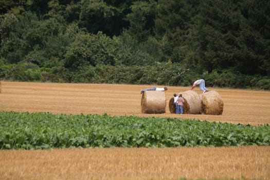 Children playing on a stubble field