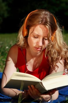 Student with book and headphones VIII