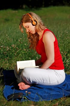 Student with book and headphones VII