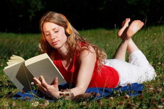 Student with book and headphones XI