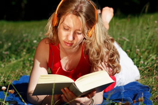 Student with book and headphones X