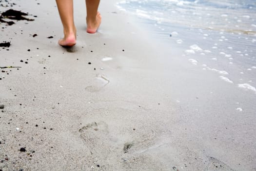 Footprints in the sand In the background you can see the feet