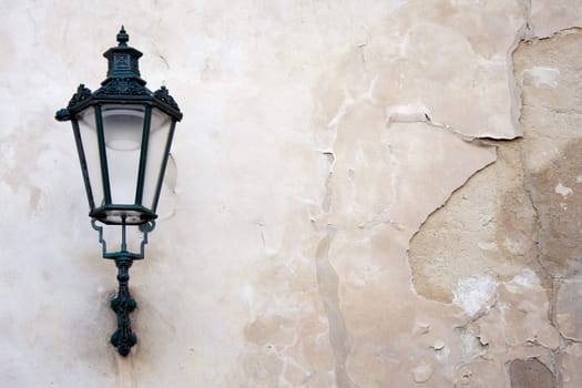Lantern on weathered wall