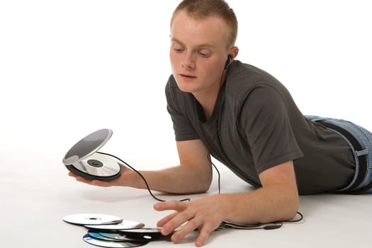 A young man with a Discman and CDs