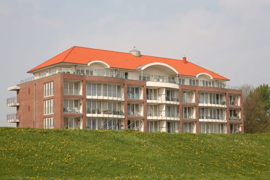 Modern residential building directly on the dike of Cuxhaven