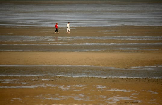Two people in the Wat of the North Sea off Cuxhaven