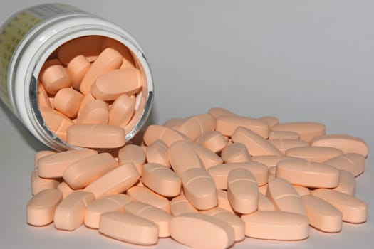 Cans and tablets on a white background