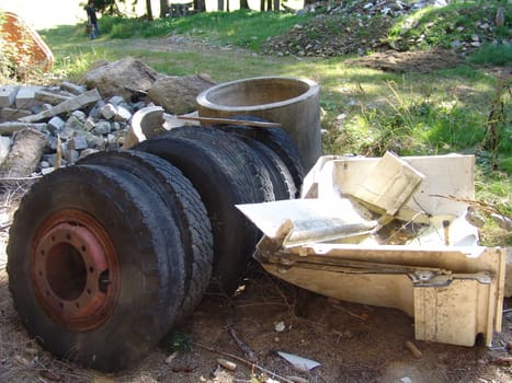 Wild garbage dump in the forest