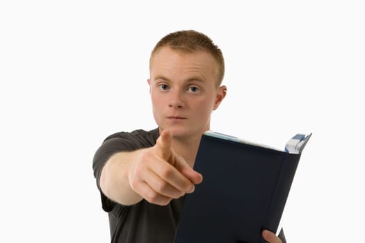 A young man with a book and his finger raised in warning