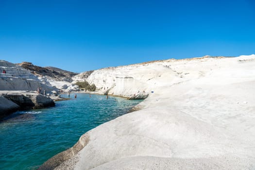 Sunrise on Sarakiniko beach with few people