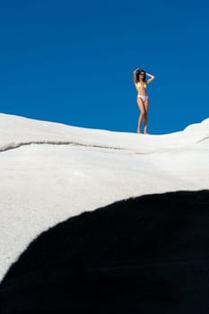 Model in bikini on Sarakiniko beach, Milos Island