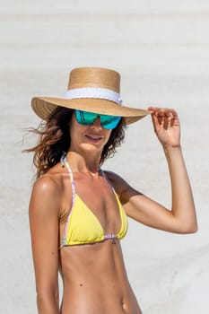 Model in bikini on Sarakiniko beach, Milos Island