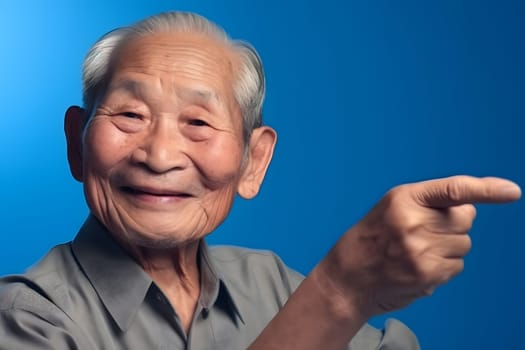 Asian grandfather looking and smiling with rised index finger on blue background. Neural network generated in May 2023. Not based on any actual person, scene or pattern.