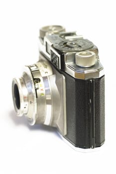 Photo camera on white background